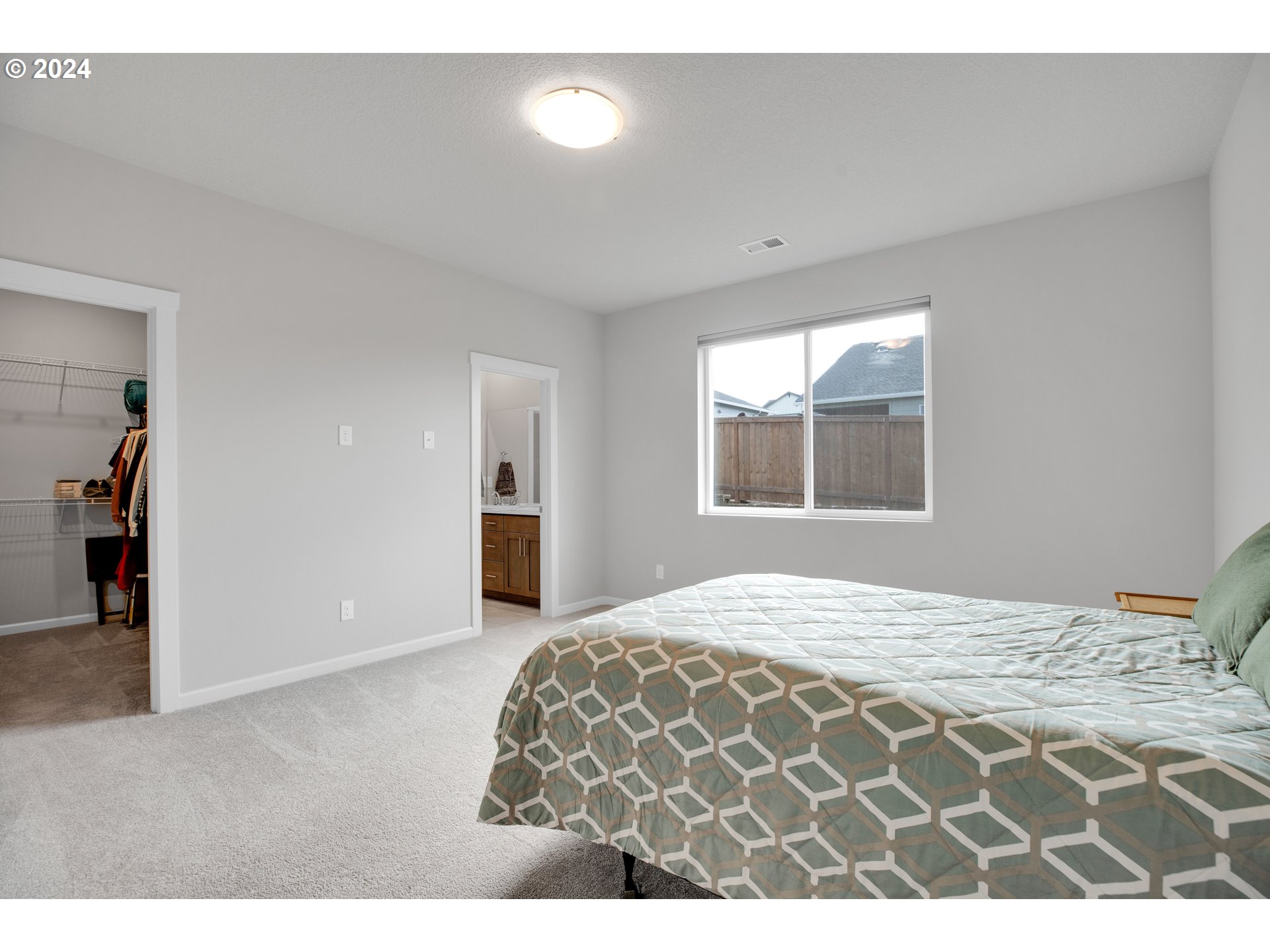 37332 Coho Street Sandy, OR 97055 - Photo 21 of 38 a bedroom with a large bed and a window