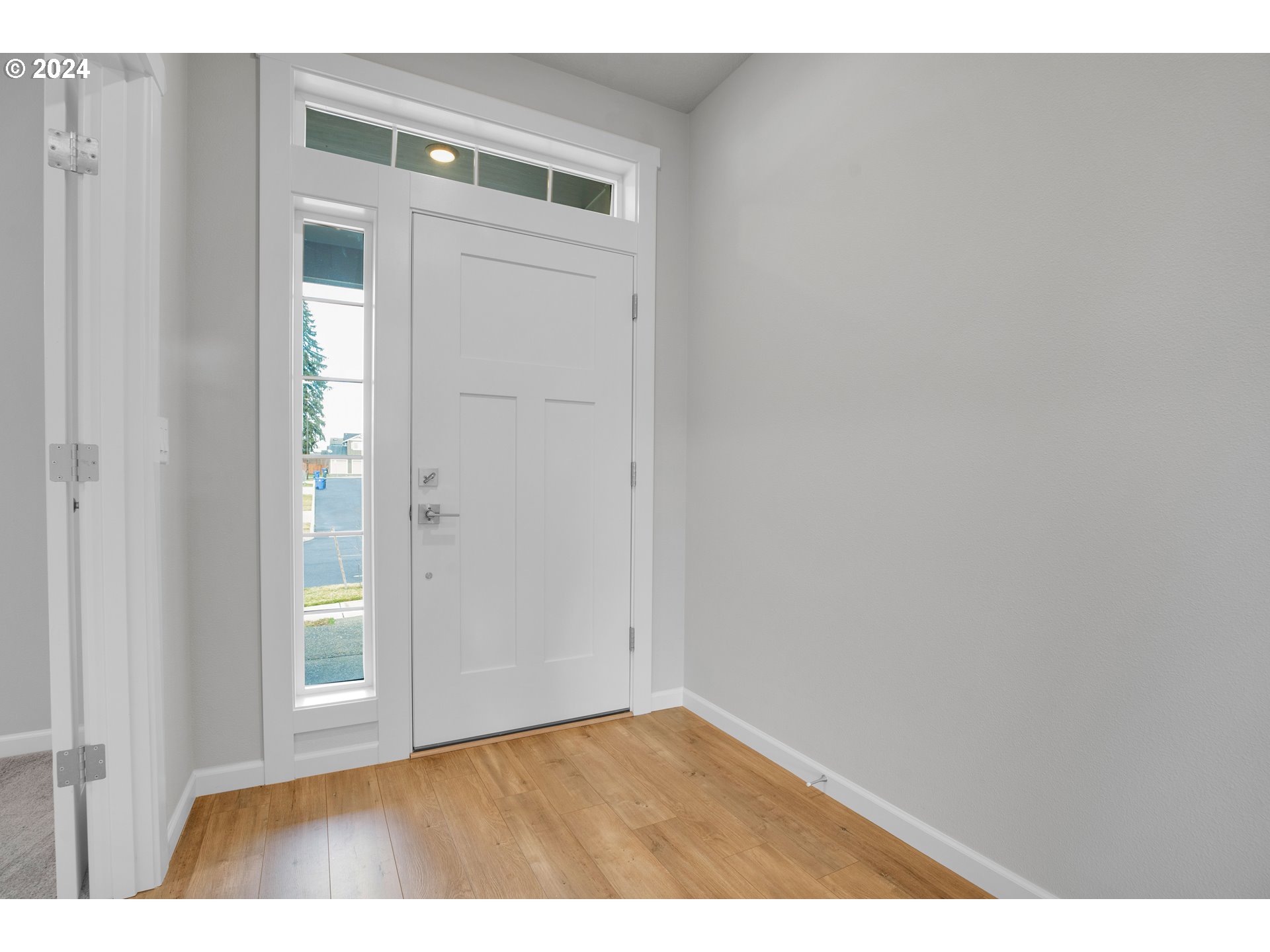 37332 Coho Street Sandy, OR 97055 - Photo 3 of 38 a view of an empty room with closet and wooden floor