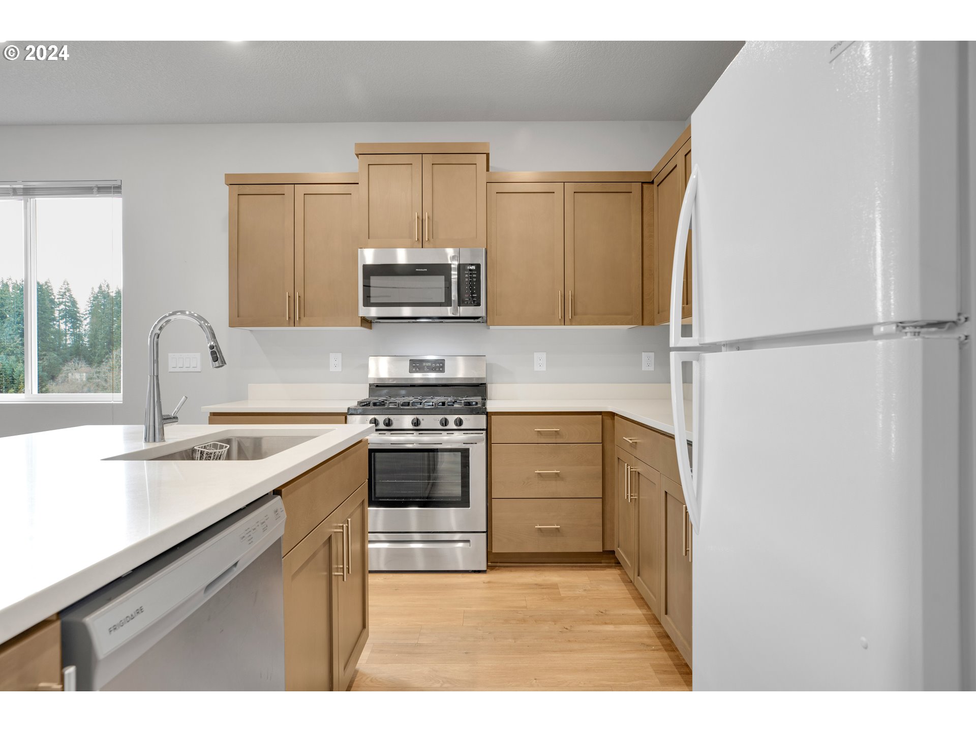37332 Coho Street Sandy, OR 97055 - Photo 7 of 38 a kitchen with stainless steel appliances granite countertop a sink stove and refrigerator