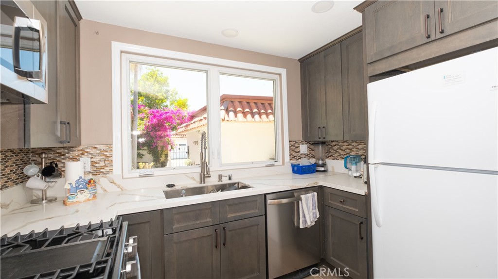 7 Satinwood Way Irvine, CA 92612 - Photo 11 of 15 a bathroom with a sink a vanity and a large mirror
