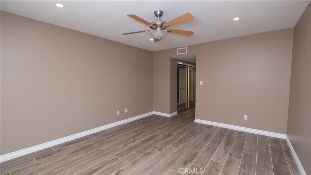 7 Satinwood Way Irvine, CA 92612 - Photo 14 of 15 wooden floor in an empty room with a window