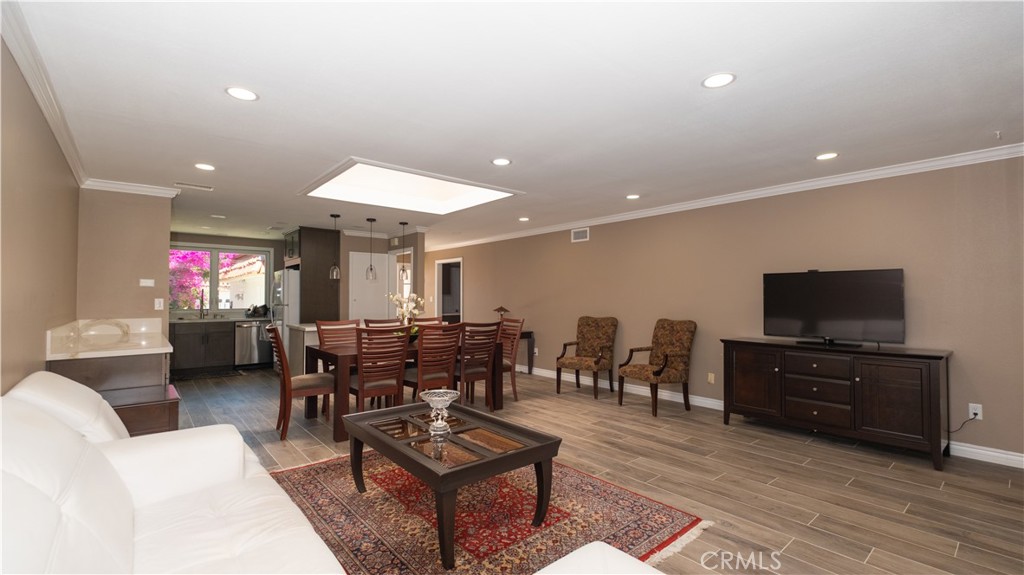 7 Satinwood Way Irvine, CA 92612 - Photo 3 of 15 a living room with furniture and a flat screen tv