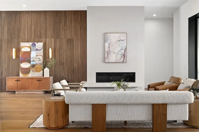 a dining room with furniture a chandelier and wooden floor