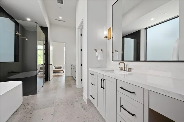 a bathroom with a sink a toilet and bathtub