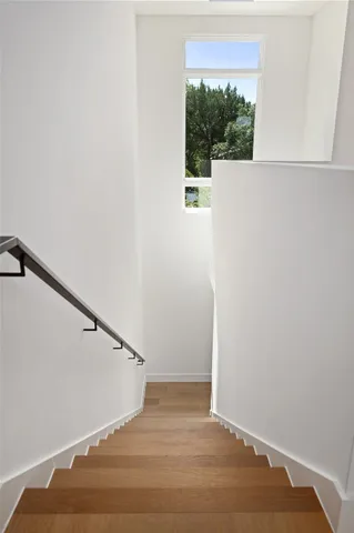 a bathroom with a toilet a sink a mirror a bathtub and vanity