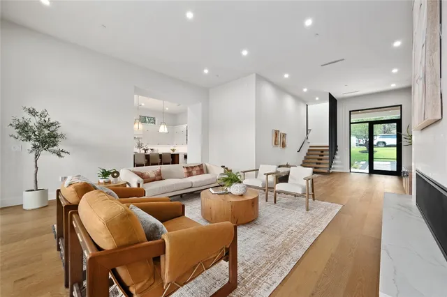 a kitchen with a stove a sink a center island and a window