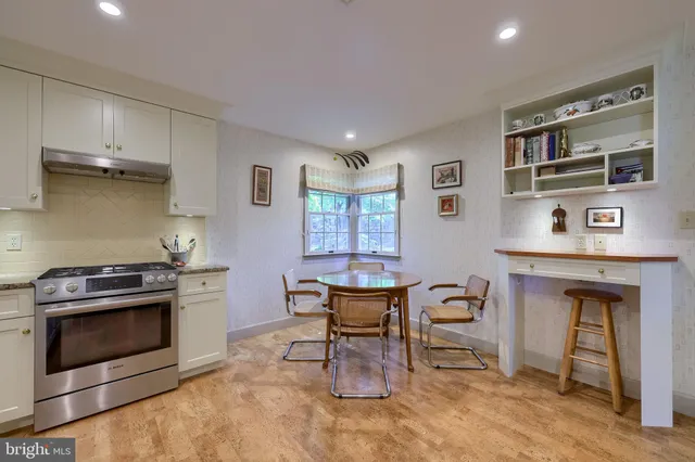 a kitchen with a stove and a refrigerator