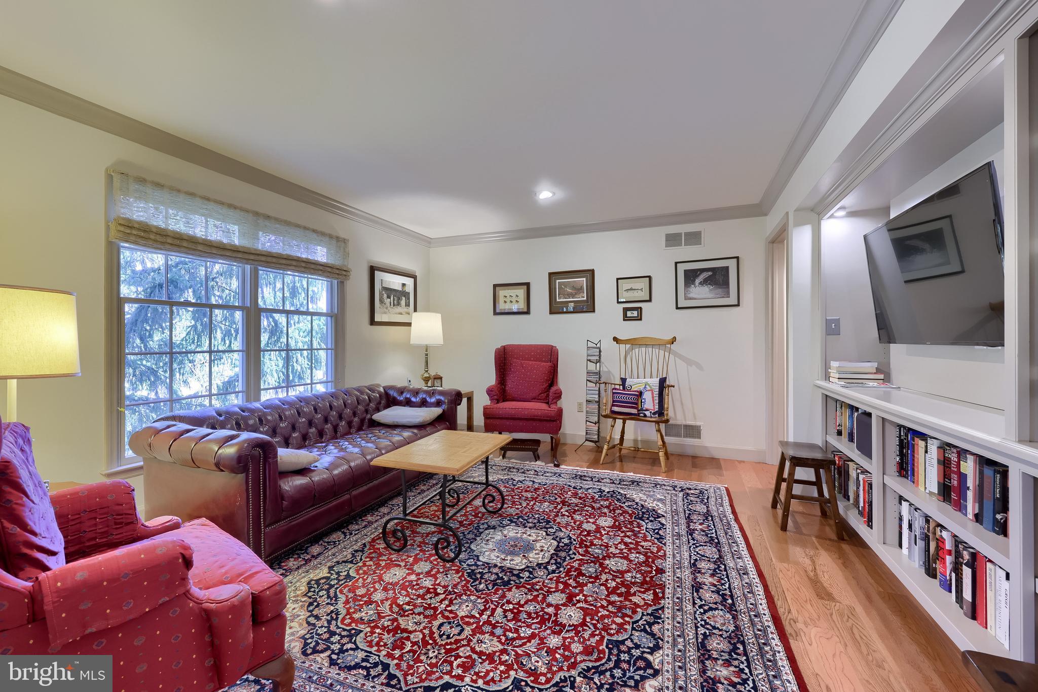 2018 Meadow Glen Reading, PA 19610 - Photo 23 of 46 a living room with furniture and a book shelf