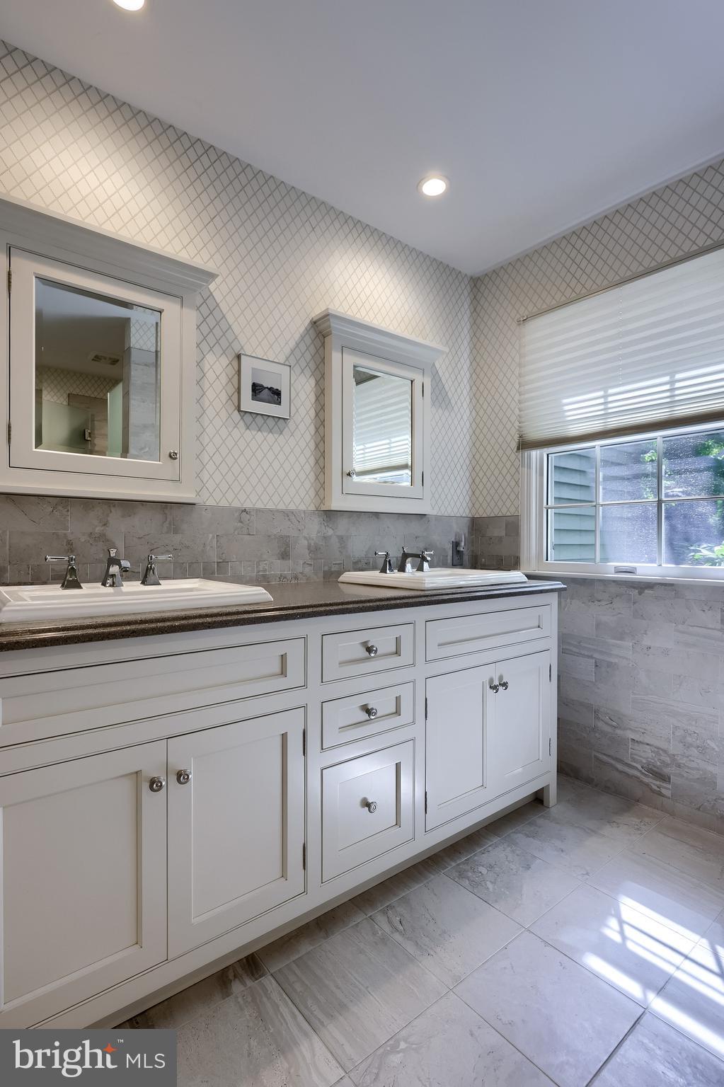 2018 Meadow Glen Reading, PA 19610 - Photo 33 of 46 a spacious bathroom with a granite countertop sink and a mirror