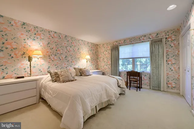 a bedroom with bed and a window