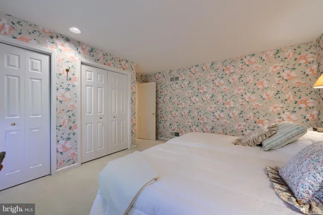 a bedroom with a bed and a bathroom