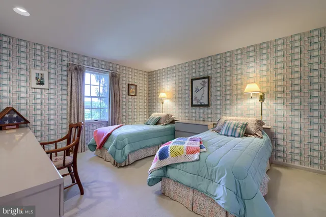 a bedroom with bed and a window