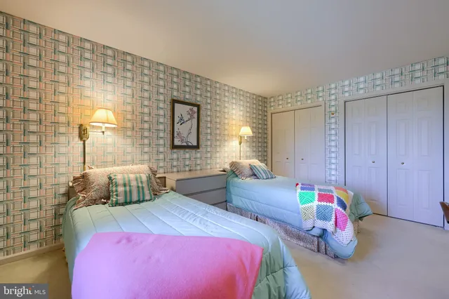 a bedroom with a bed and a lamp