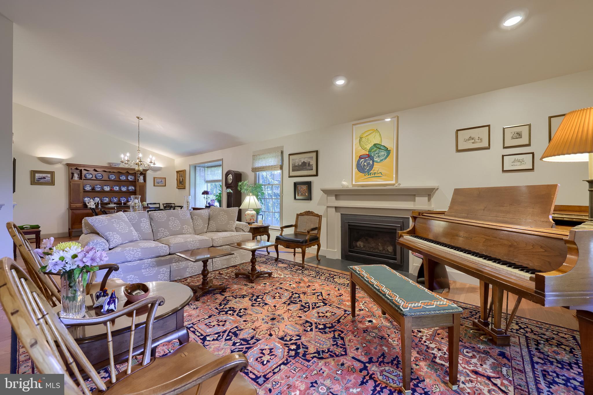 2018 Meadow Glen Reading, PA 19610 - Photo 9 of 46 a living room with furniture a rug and a fireplace