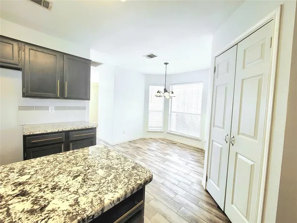 a bedroom with a bed and a stove top oven