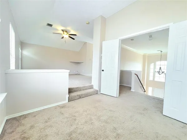 a bathroom with a tub a sink and a window