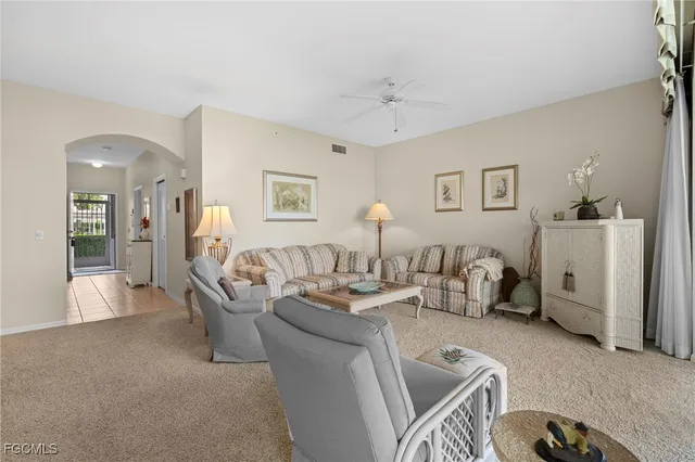 a living room with furniture and a table