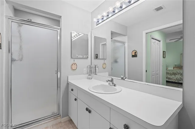 a bathroom with a sink double vanity and a mirror