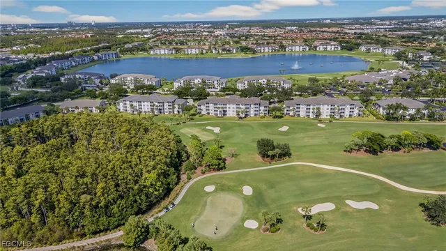 an aerial view of a pool yard and outdoor seating