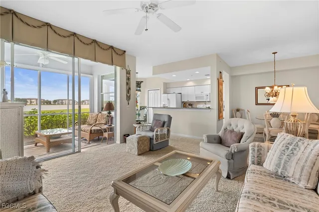 a living room with furniture or outdoor view and a chandelier
