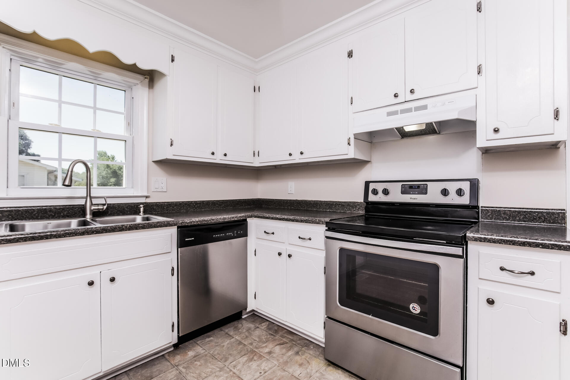 870 Abbott Road Henderson, NC 27537 - Photo 10 of 20 a kitchen with granite countertop white cabinets and white stainless steel appliances