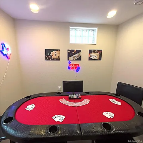 a bedroom with a bed and chandelier