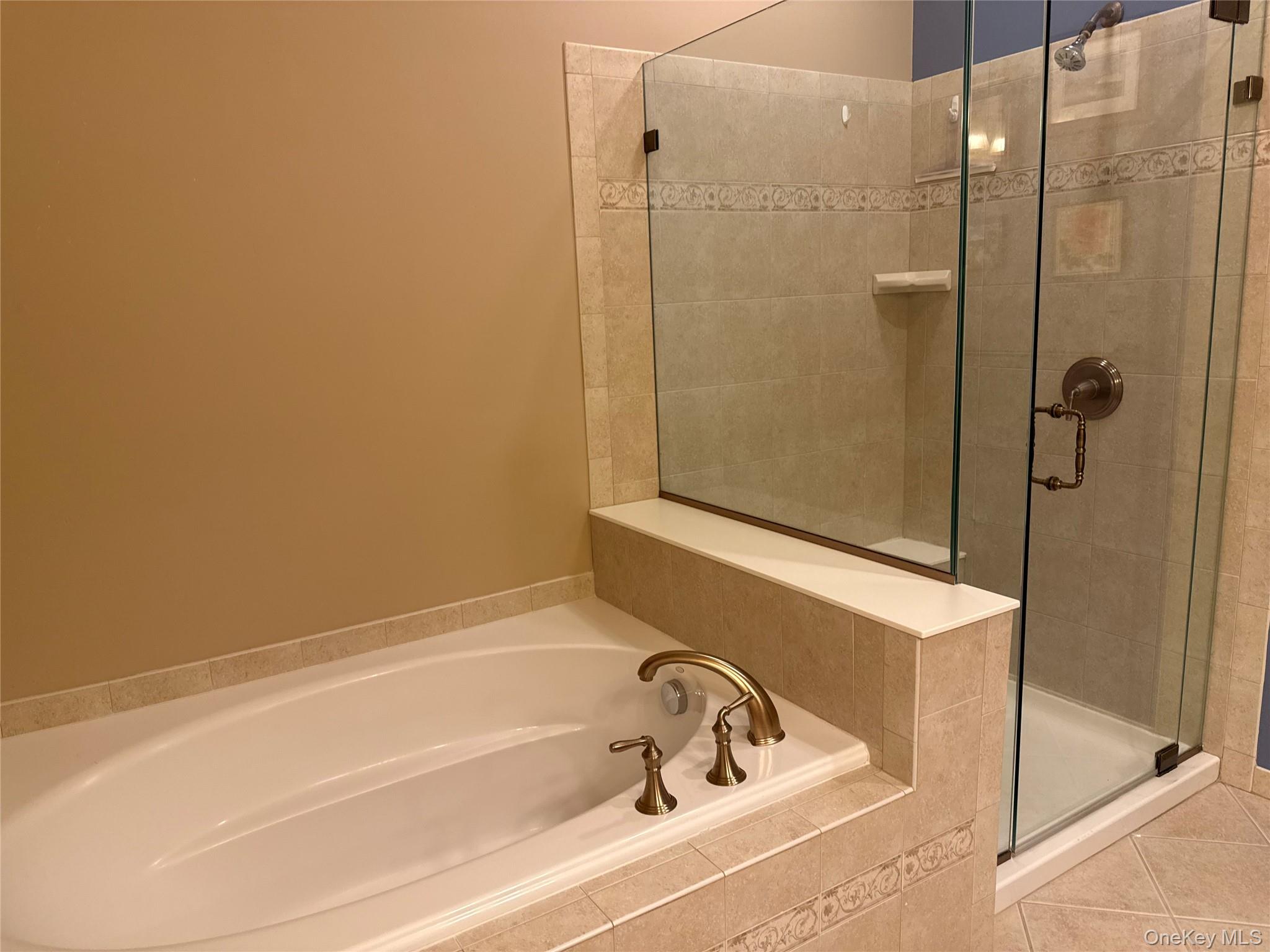 246 Regency Drive Fishkill, NY 12524 - Photo 16 of 20 a bathroom with a bathtub and shower