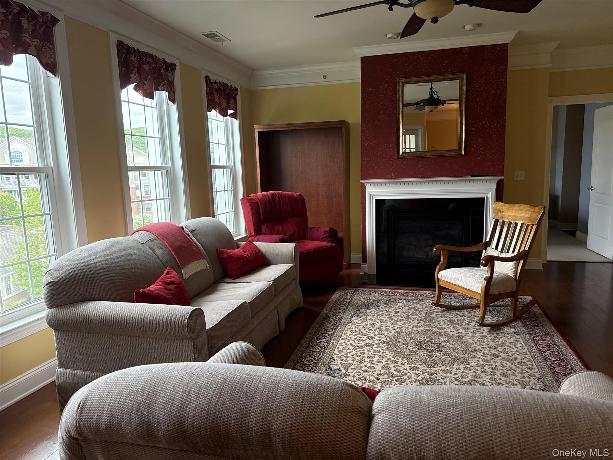246 Regency Drive Fishkill, NY 12524 - Photo 4 of 20 a living room with furniture and a fireplace