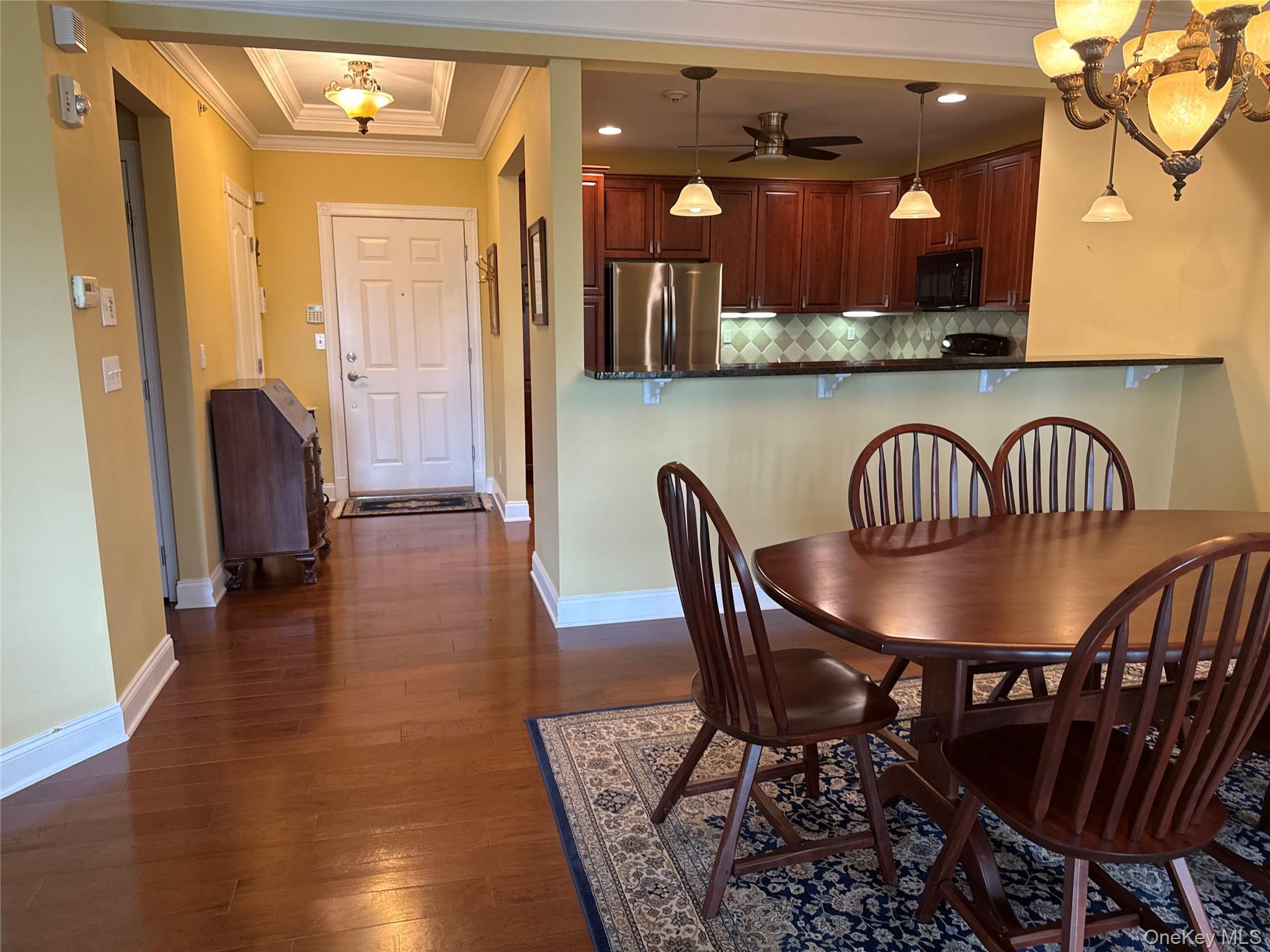 246 Regency Drive Fishkill, NY 12524 - Photo 9 of 20 a view of a dining room with furniture and wooden floor