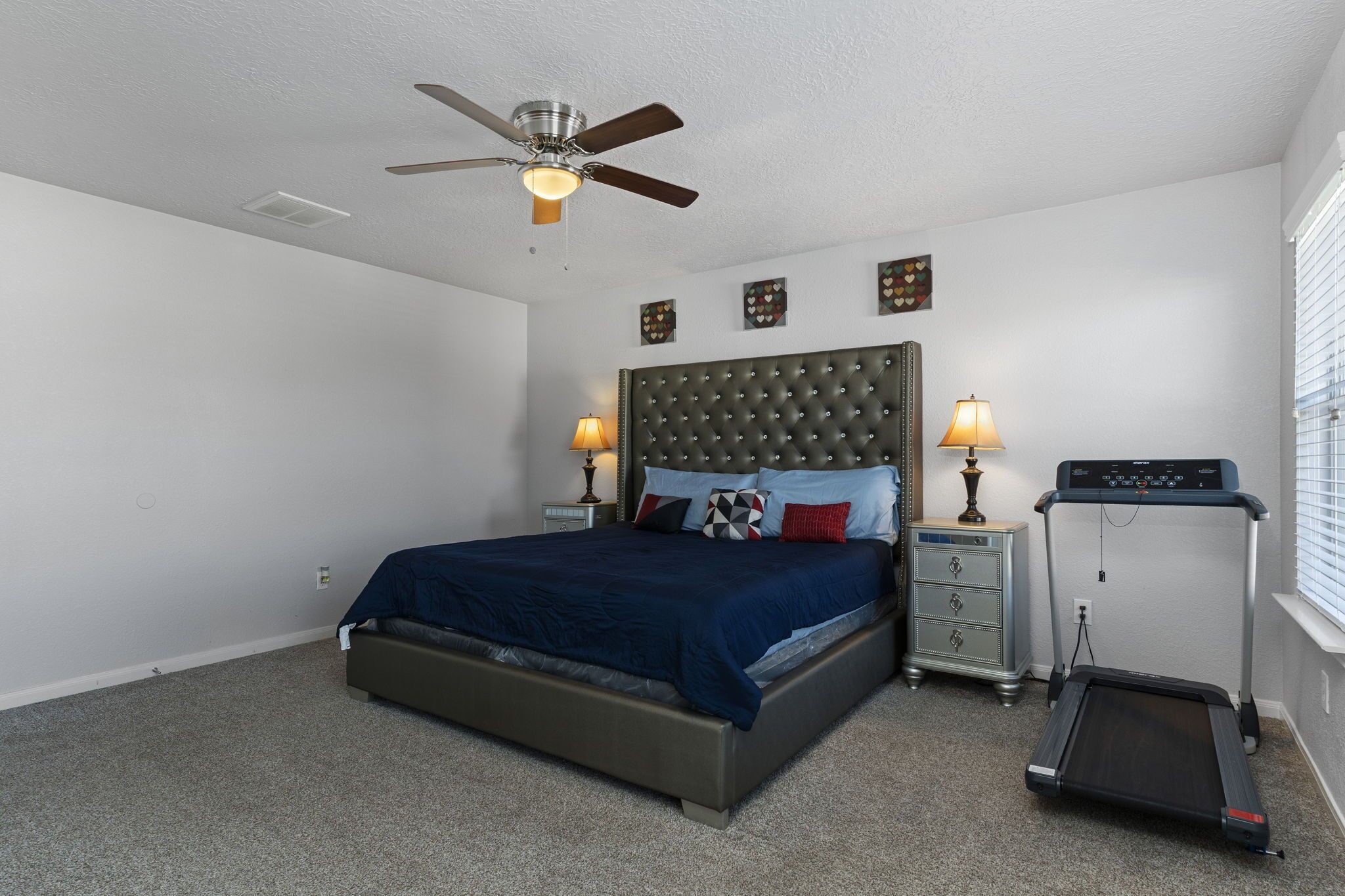 29326 Legends Green Drive Spring, TX 77386 - Photo 16 of 31 a bedroom with a bed and a ceiling fan