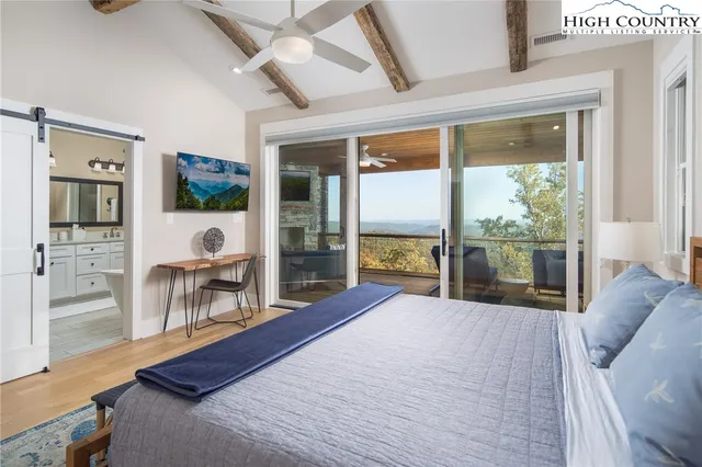 a bathroom with a tub a sink and mirror