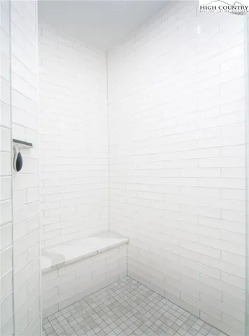 a view of a deck with wooden floor and outdoor seating