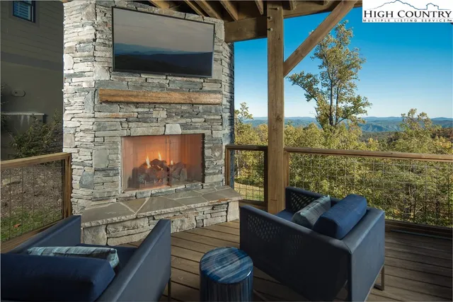 a living room with fireplace furniture and a flat screen tv