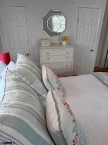 a bedroom with a bed and a dresser