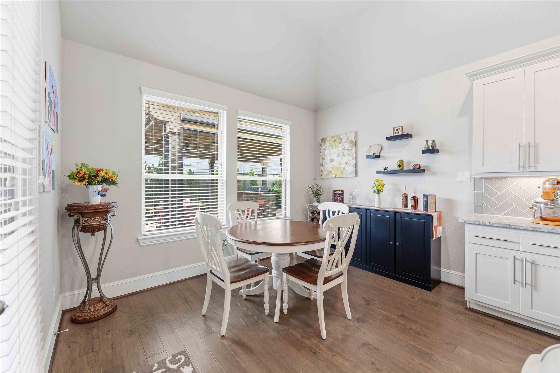 10127 Cooper's Hawk Way Conroe, TX 77385 - Photo 13 of 35 Quaint breakfast nook overlooking the serene backyard