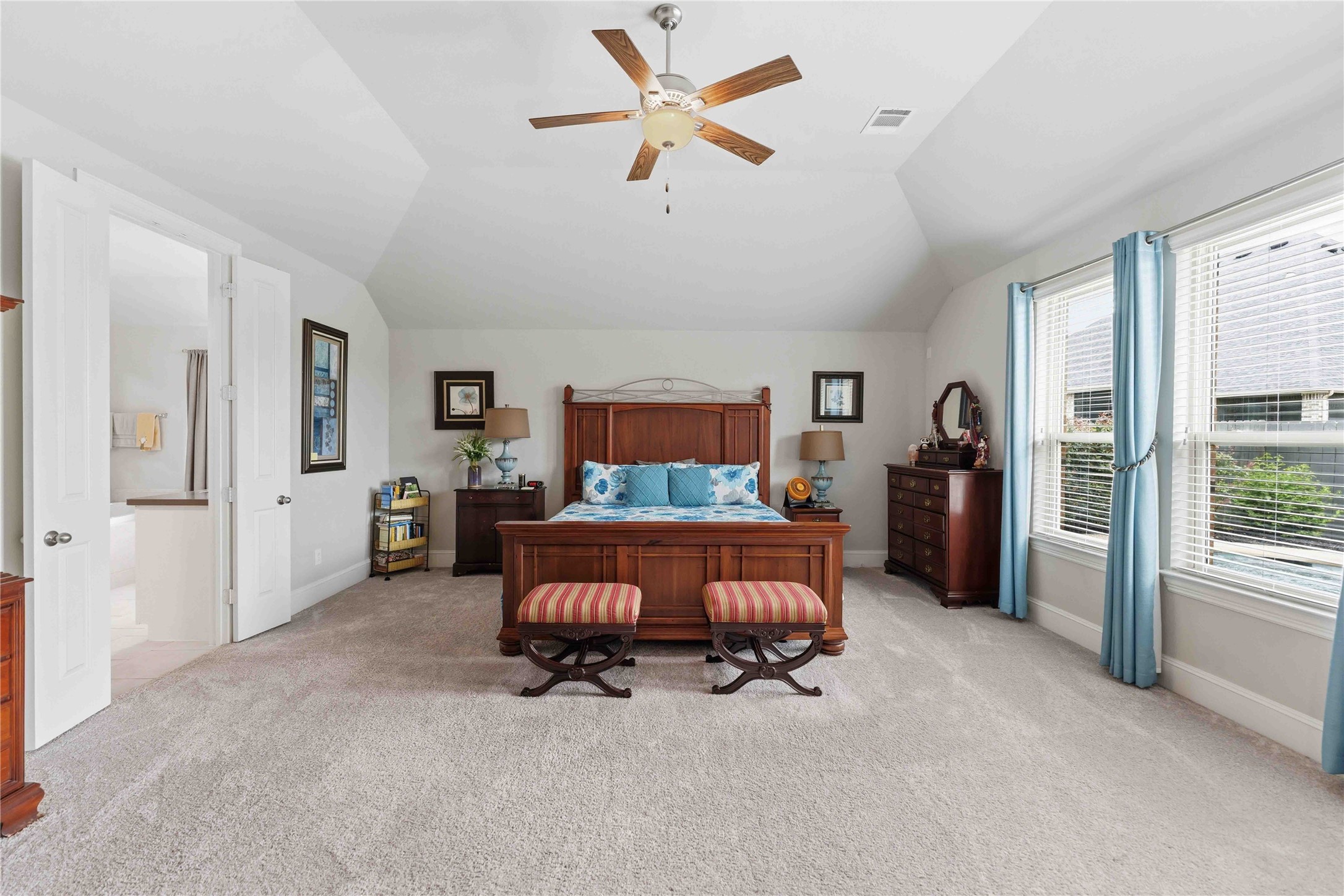 10127 Cooper's Hawk Way Conroe, TX 77385 - Photo 16 of 35 Extended primary bedroom offers relaxing views of the backyard