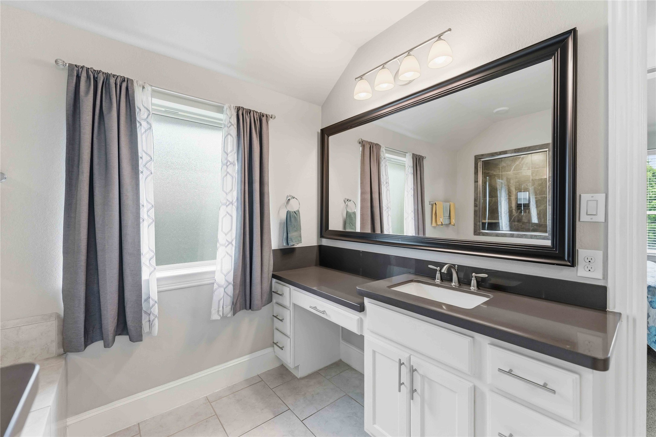 10127 Cooper's Hawk Way Conroe, TX 77385 - Photo 19 of 35 Luxurious primary bath with dual sinks, soaking tub and separate shower