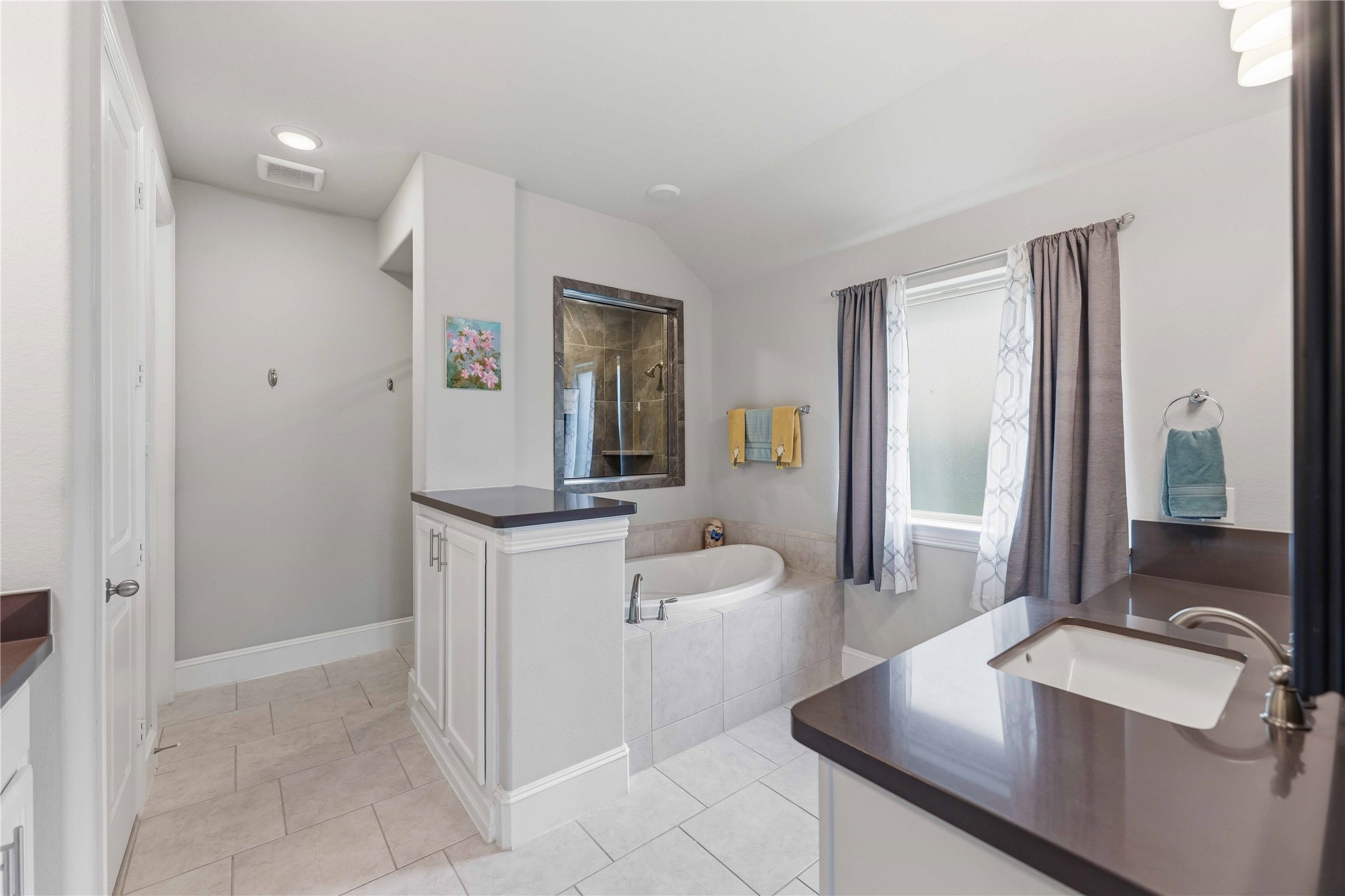 10127 Cooper's Hawk Way Conroe, TX 77385 - Photo 20 of 35 Luxurious primary bath with dual sinks, soaking tub and separate shower