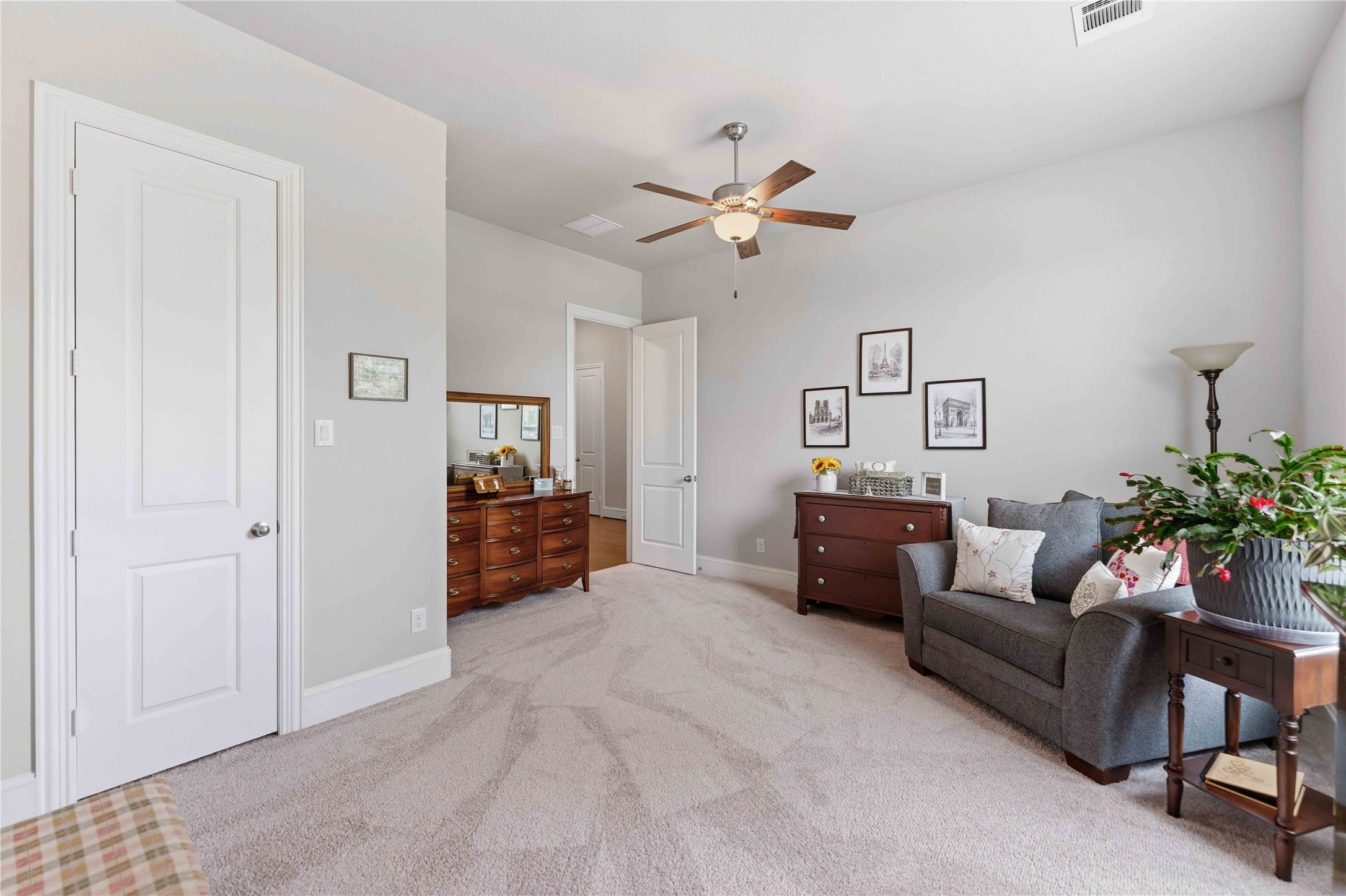 10127 Cooper's Hawk Way Conroe, TX 77385 - Photo 22 of 35 Oversized secondary bedroom is enough for a king bed and sitting area.