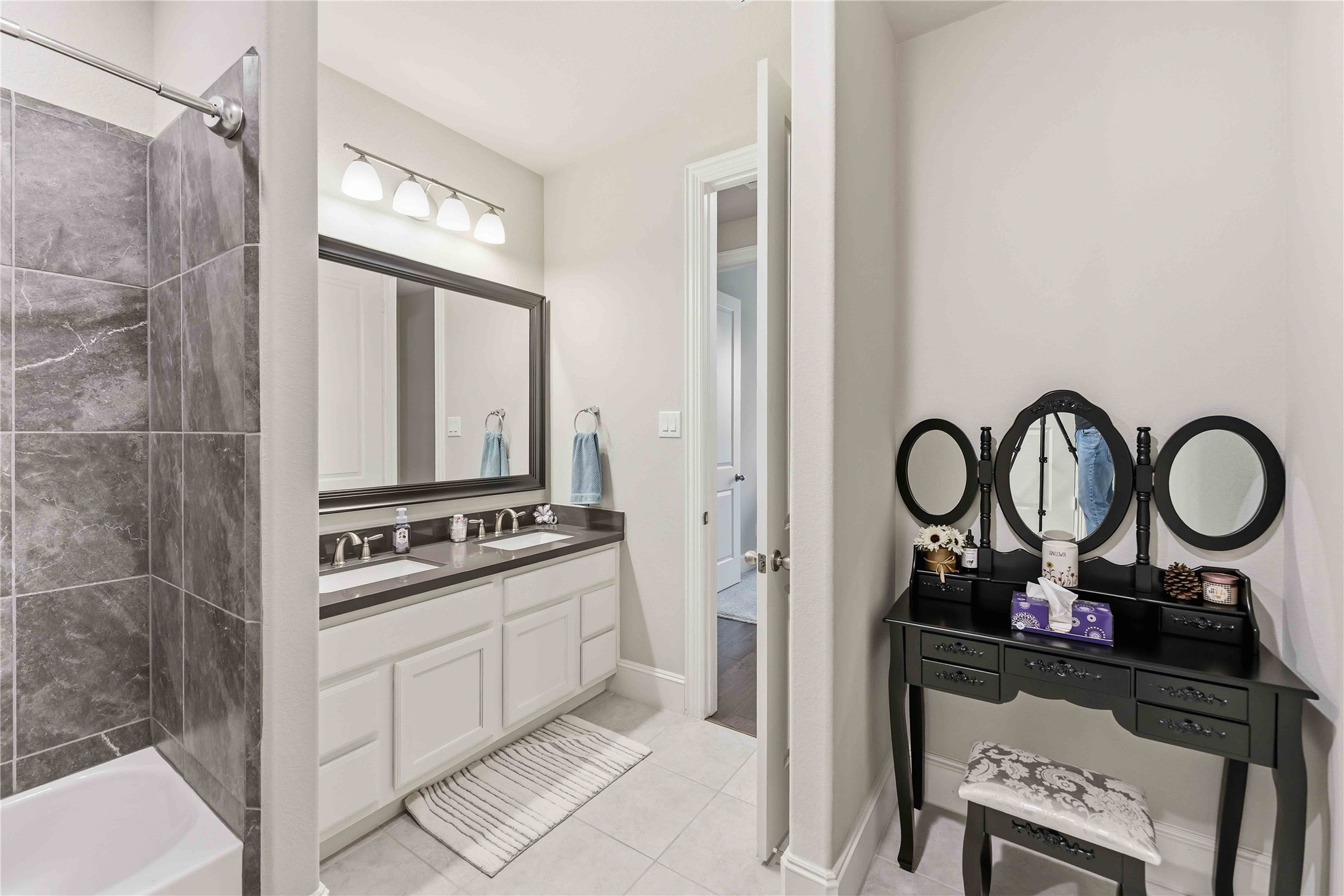 10127 Cooper's Hawk Way Conroe, TX 77385 - Photo 25 of 35 Secondary bedroom offers rare dual sinks....makes getting ready quick and convenient