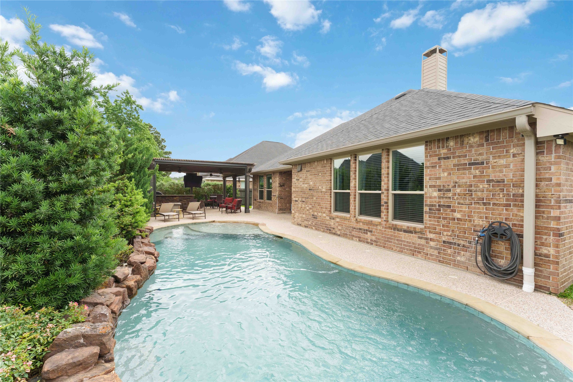 10127 Cooper's Hawk Way Conroe, TX 77385 - Photo 29 of 35 Sparkling zero entry pool with a chiller