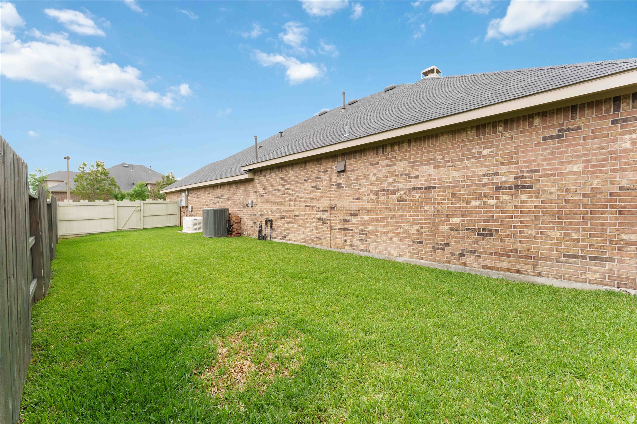 10127 Cooper's Hawk Way Conroe, TX 77385 - Photo 30 of 35 This home was built on a larger lot offering additional backyard space for gardening and playtime.