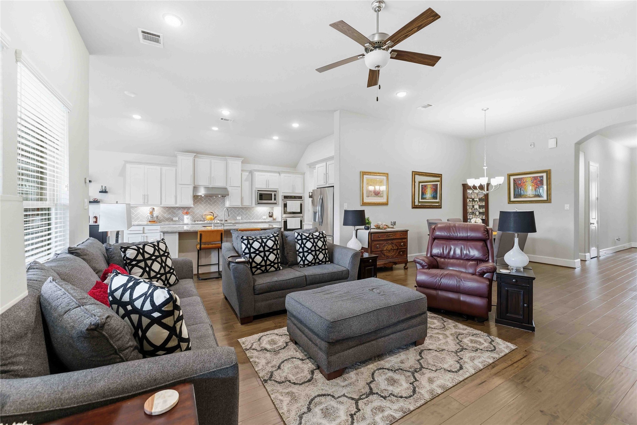 10127 Cooper's Hawk Way Conroe, TX 77385 - Photo 33 of 35 The bright kitchen overlooks the spacious living room in this open concept floorplan