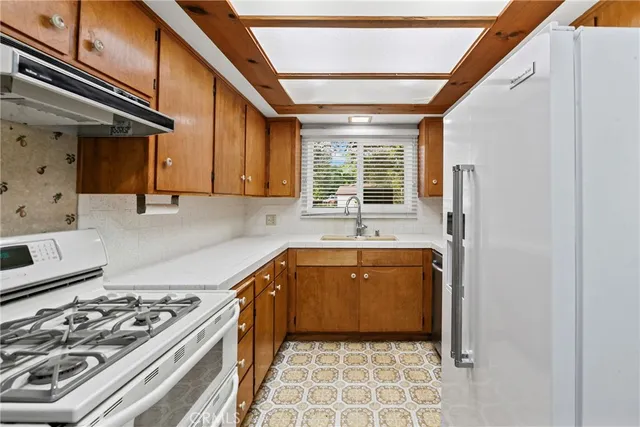 a kitchen with a stove and a sink