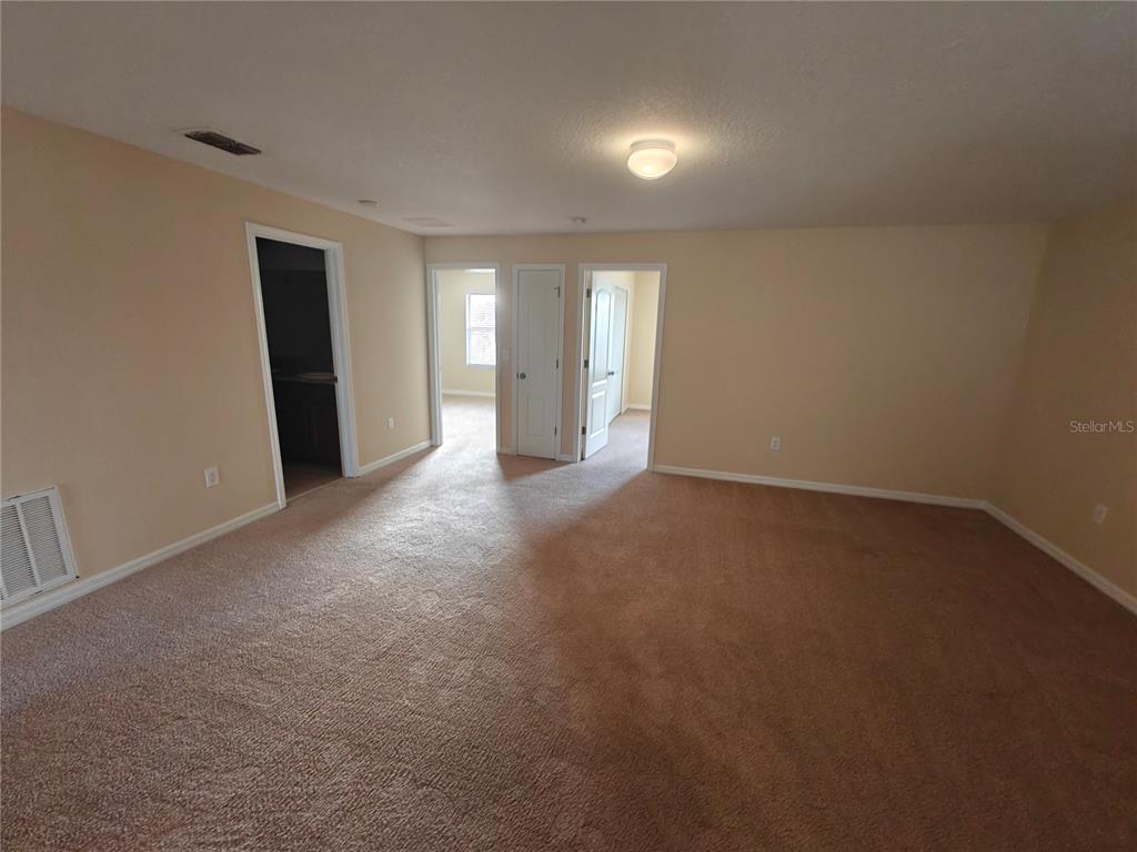3410 Rodrick Circle Orlando, FL 32824 - Photo 14 of 27 a view of a big room with windows and cabinet