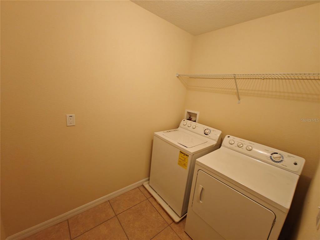 3410 Rodrick Circle Orlando, FL 32824 - Photo 17 of 27 a utility room with dryer and washer