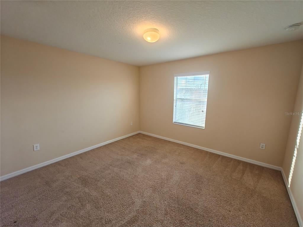 3410 Rodrick Circle Orlando, FL 32824 - Photo 19 of 27 an empty room with a window
