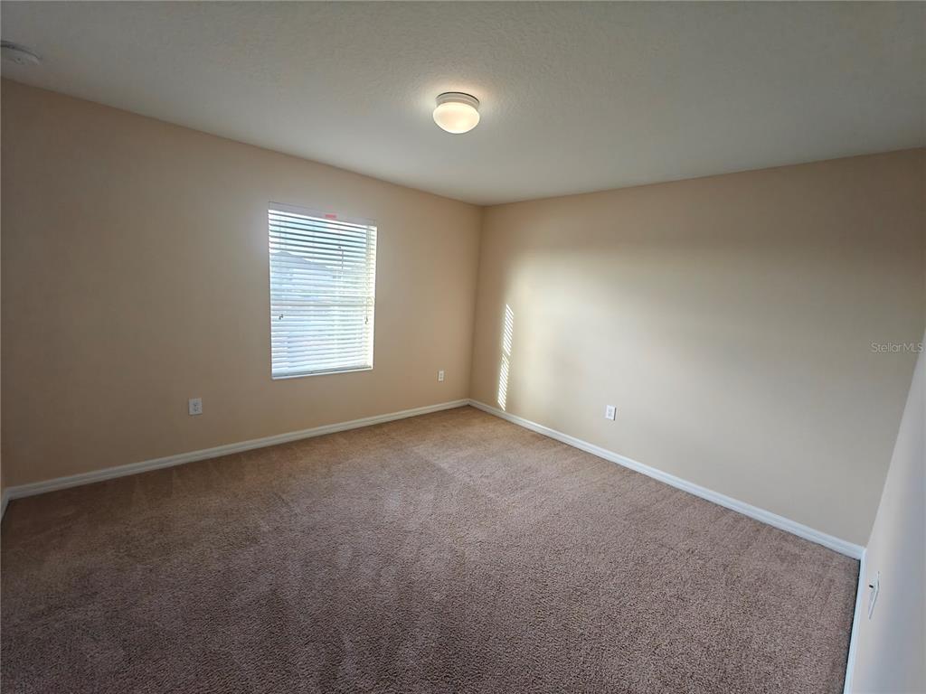 3410 Rodrick Circle Orlando, FL 32824 - Photo 20 of 27 an empty room with windows