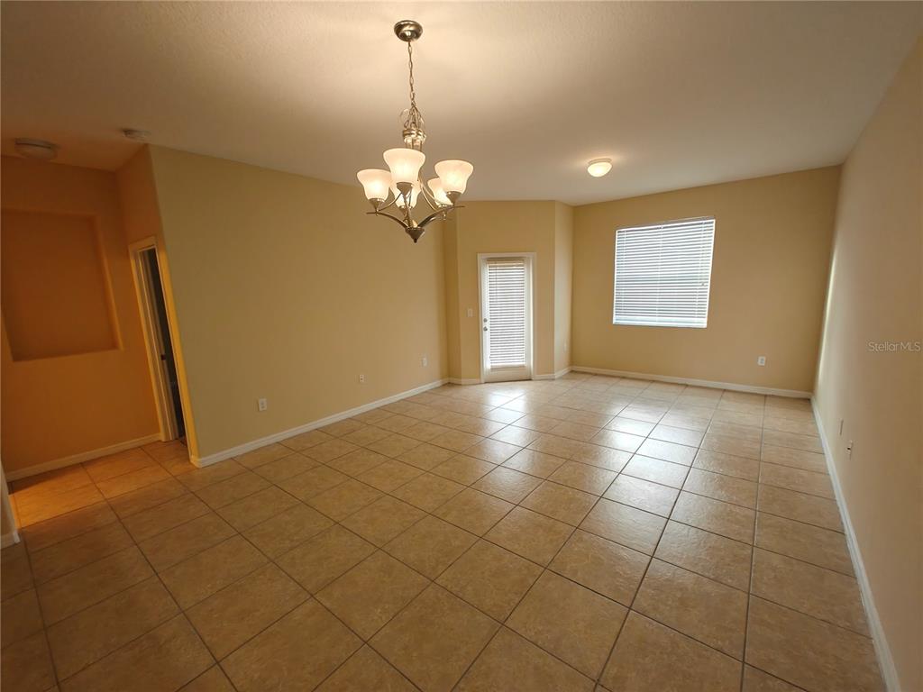 3410 Rodrick Circle Orlando, FL 32824 - Photo 5 of 27 a view of a livingroom with a chandelier furniture and windows
