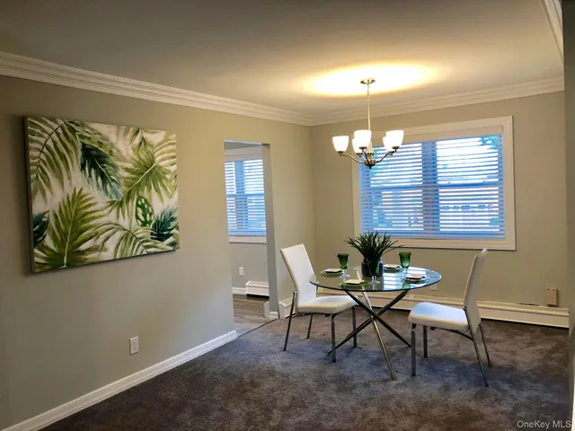 a dining room with furniture and window